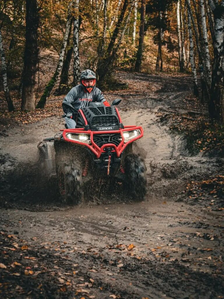 How Does the LONCIN XWolf1000 Mud Perform in Deep Mud? 1 LONCIN XWolf1000 Mud Close-up of tire mud splatter